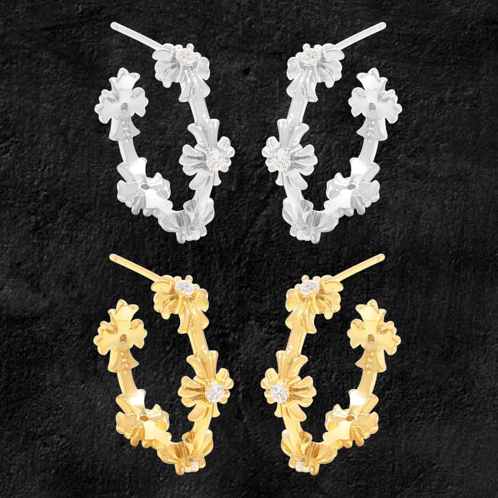 Pair of floral-embellished hoop earrings in silver and gold finishes.