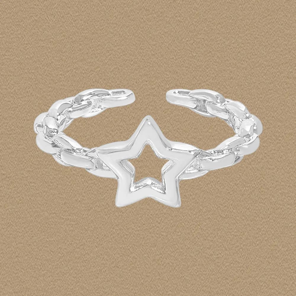 Polished sterling silver Star Cutout Ring with a linked band and open star centerpiece on a neutral background.
