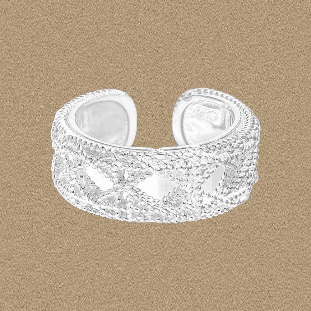 Open cuff silver ring with a woven, rope-like texture and polished finish.