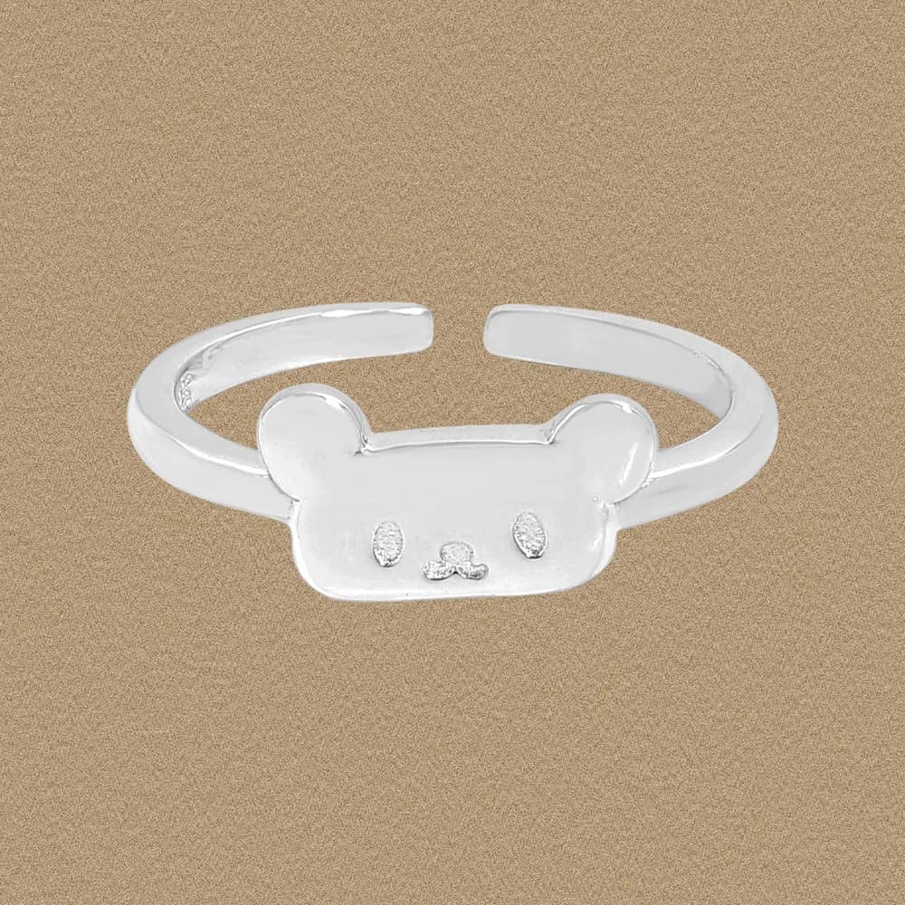 Polished sterling silver ring featuring a flat bear face on an open band.