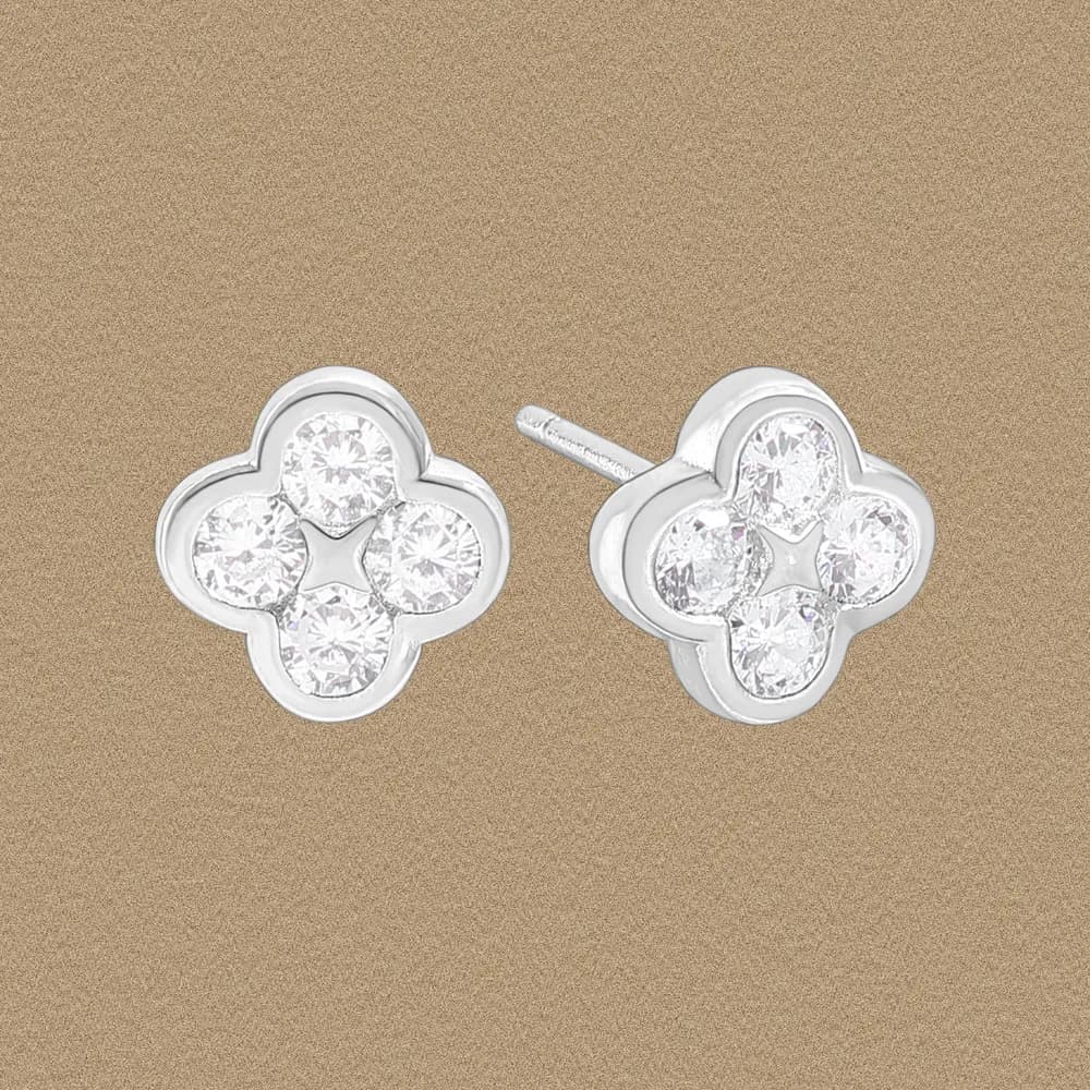 Polished sterling silver four-leaf clover stud earrings with four clear stones