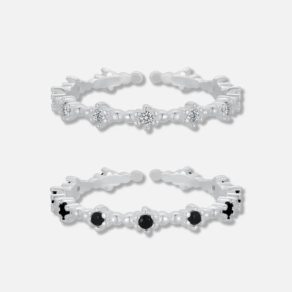 Sterling silver bead-link ring with round diamonds set along the center, featuring polished floral-inspired links.