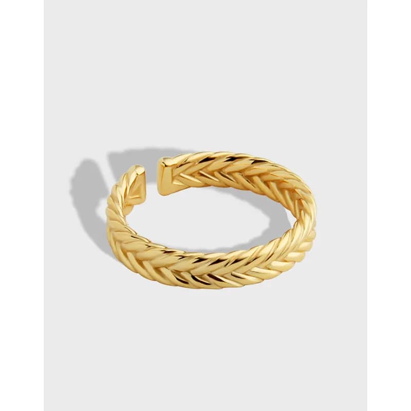 Close-up of a polished sterling silver twisted rope ring with open ends and squared caps.