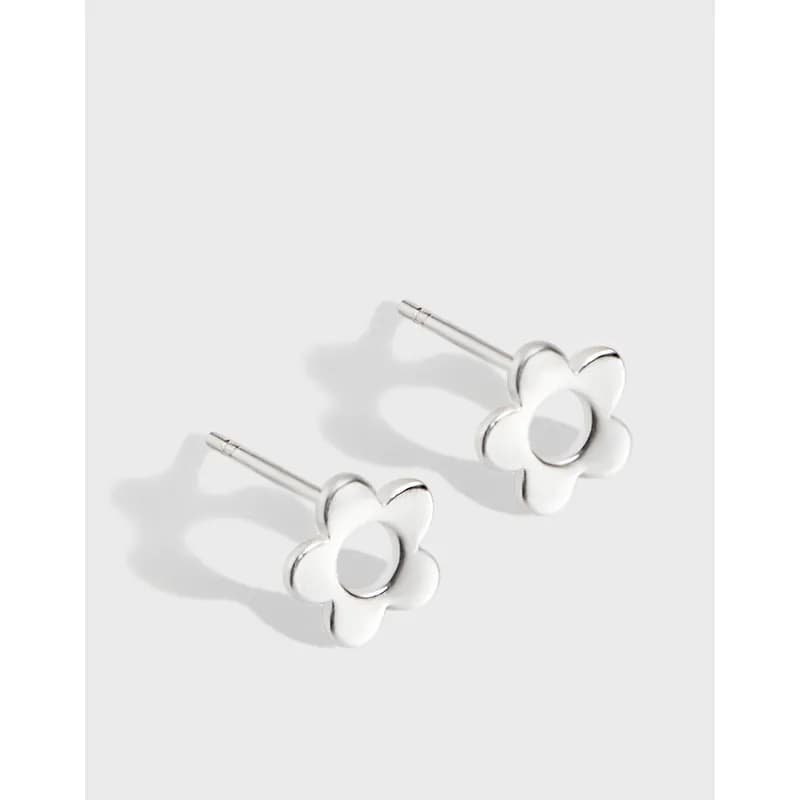 Polished sterling silver flower-shaped stud earrings shown on a light background.