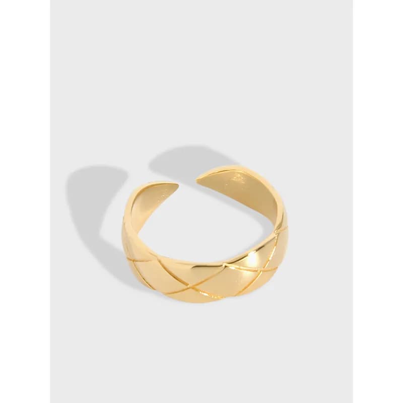 Polished sterling silver crisscross band ring with intertwining curved bands.