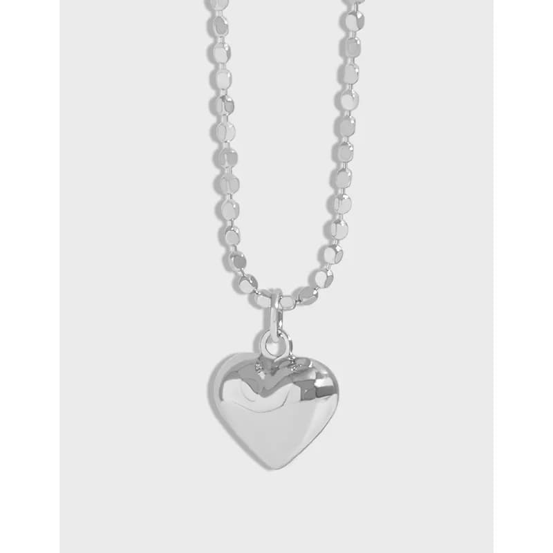 Polished sterling silver heart pendant on a round-bead chain necklace
