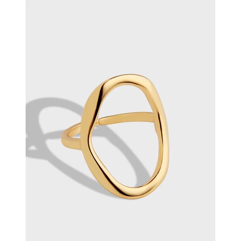 Polished sterling silver ring with a large open oval loop design on a light background.