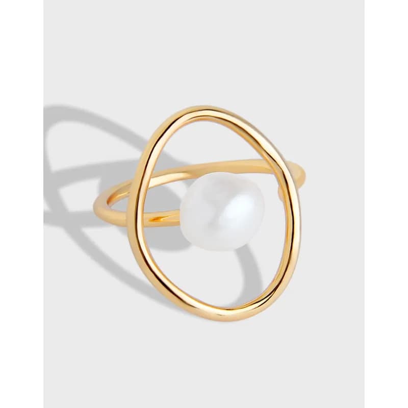 Polished sterling silver ring with an open oval frame and a single white pearl centered inside