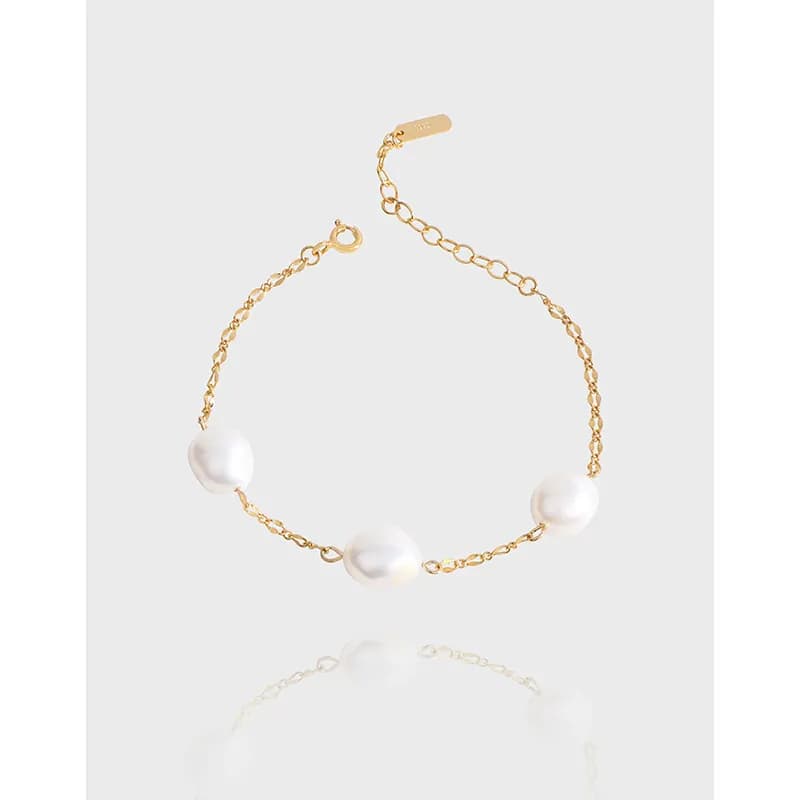 Polished sterling silver bracelet with three irregular white freshwater pearls on a fine chain with extender clasp
