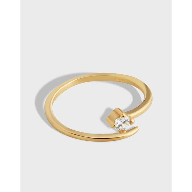 Polished sterling silver open-ring with a single clear stone at the end