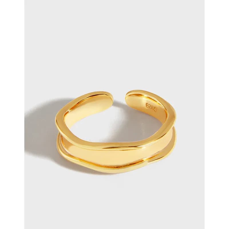 Two polished double bands cross over each other in an open wrap ring.