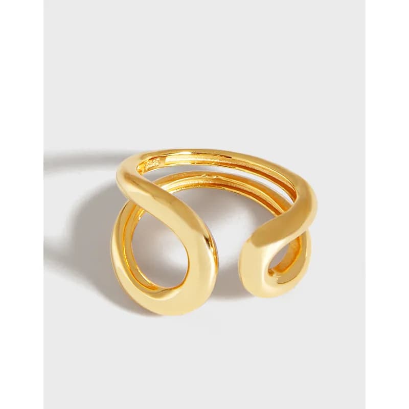 Polished sterling silver ring with two intertwined rounded bands forming an open, sculptural silhouette.