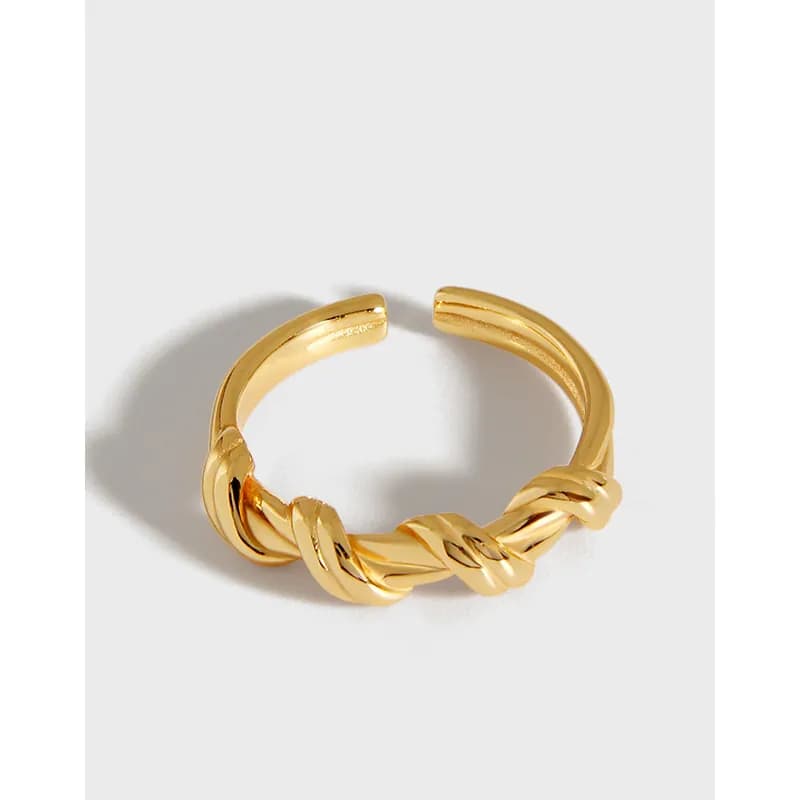 Polished sterling silver ring with a front twisted rope knot detail and open back