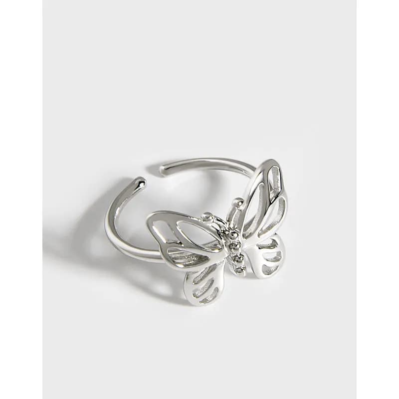 Polished sterling silver butterfly ring with openwork wings on a slim band