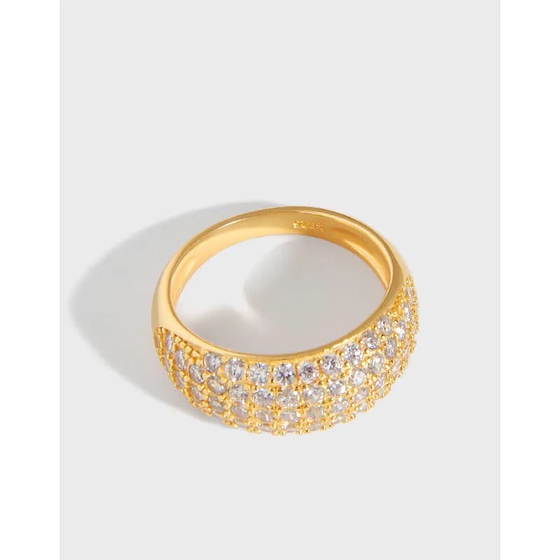 Gold-tone pavé crystal ring with multiple rows of stones on a polished band