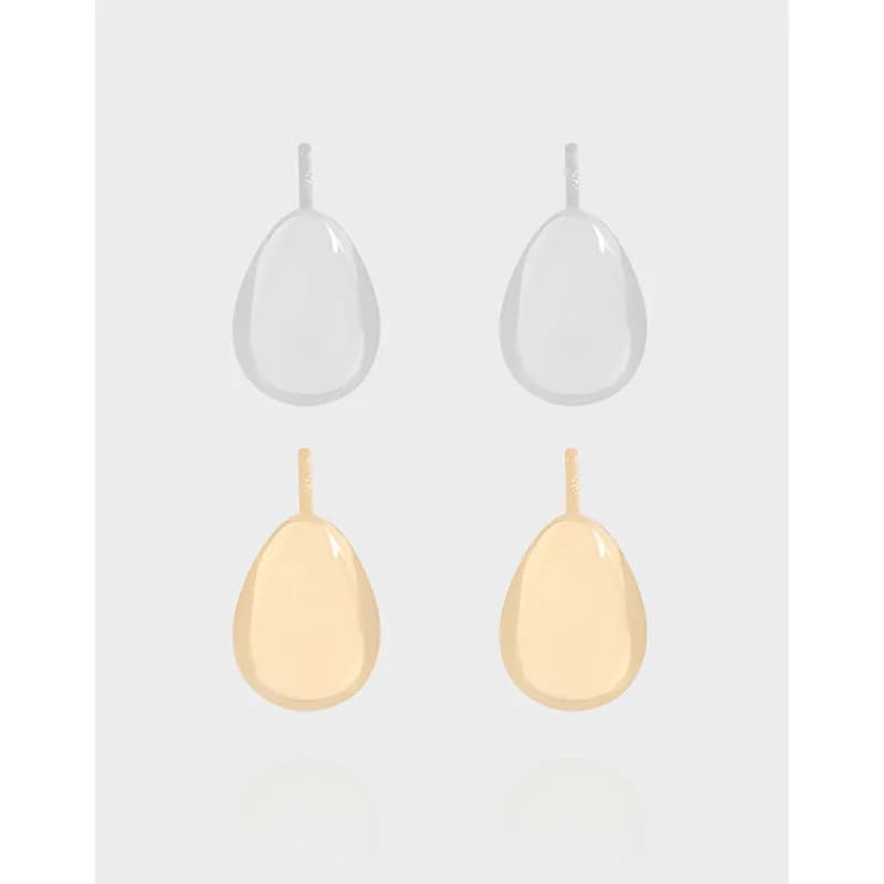 Polished teardrop earrings in silver and gold-tone finishes displayed side by side.