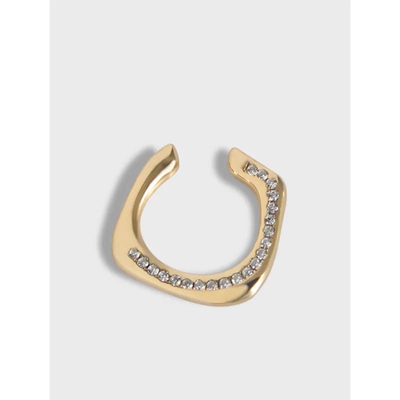 Polished crescent hoop earring with a row of pavé stones along the inner curve