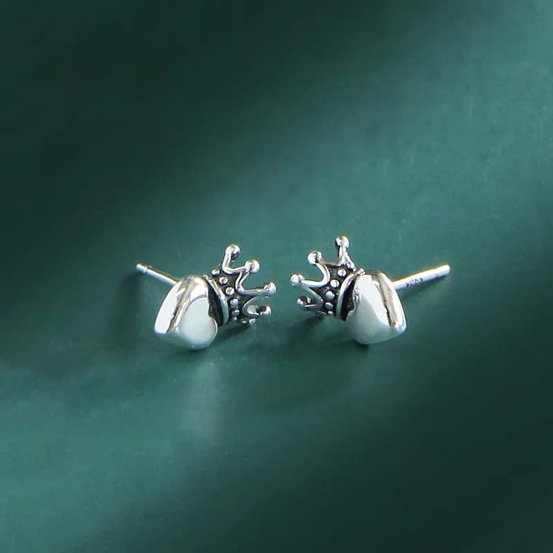 Close-up of Sterling Silver Crown Pearl Stud Earrings with posts showing
