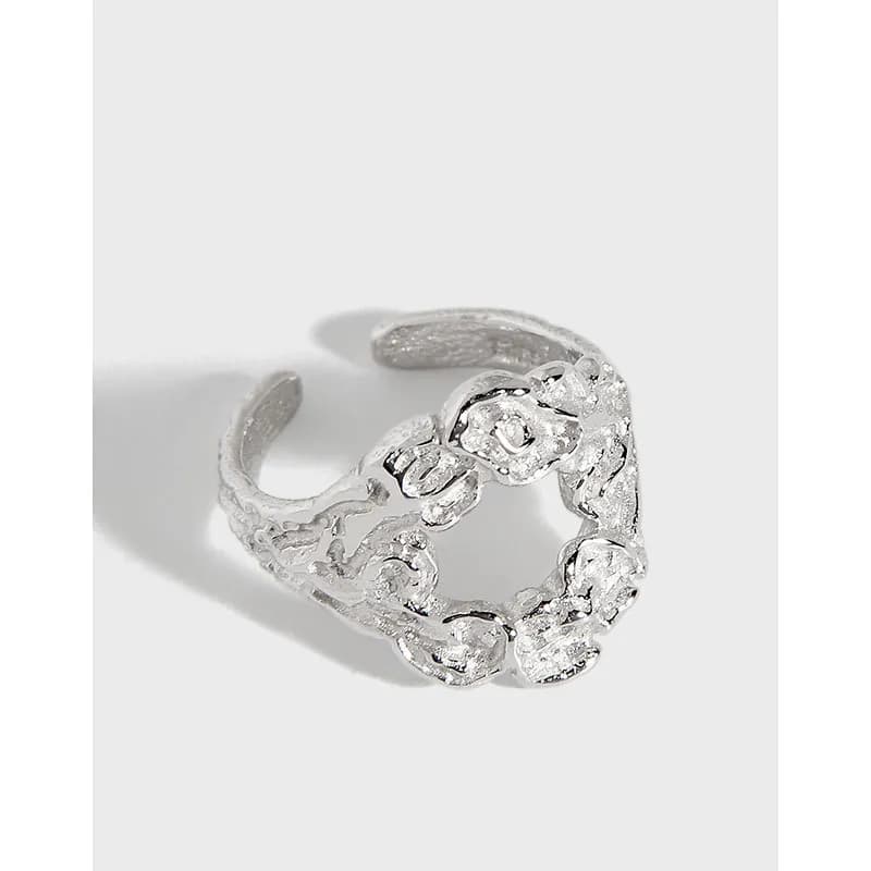 Open sterling silver ring with a heart-shaped link design in polished finish.