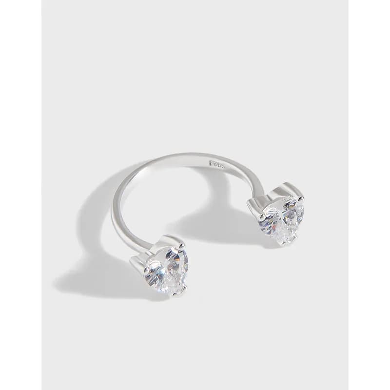 Open-ended ring in sterling silver with two pear-cut stones at the ends