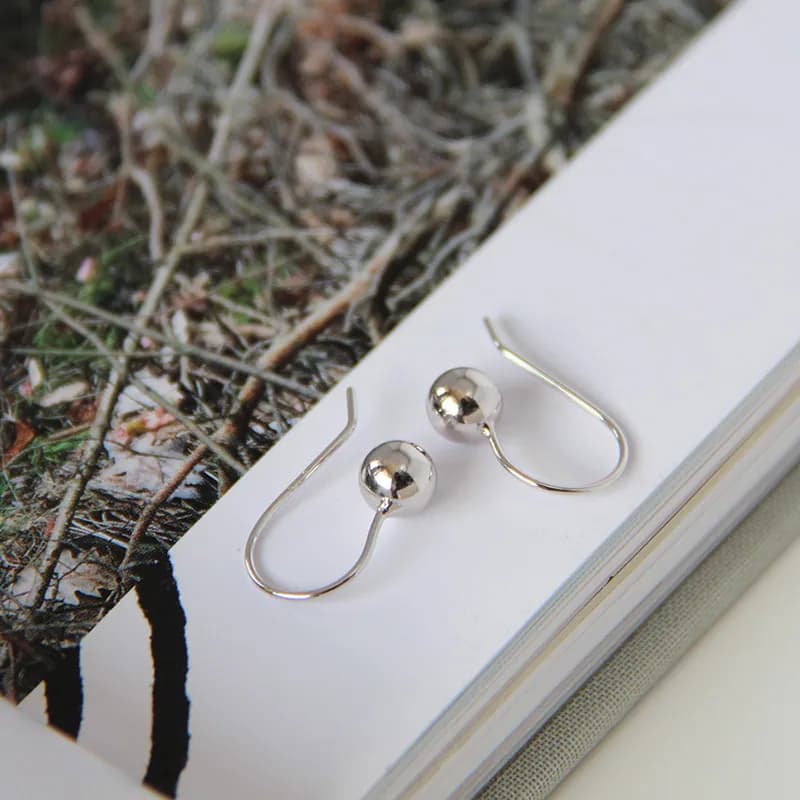 Polished sterling silver ball bead drop earrings with a curved U-shaped wire