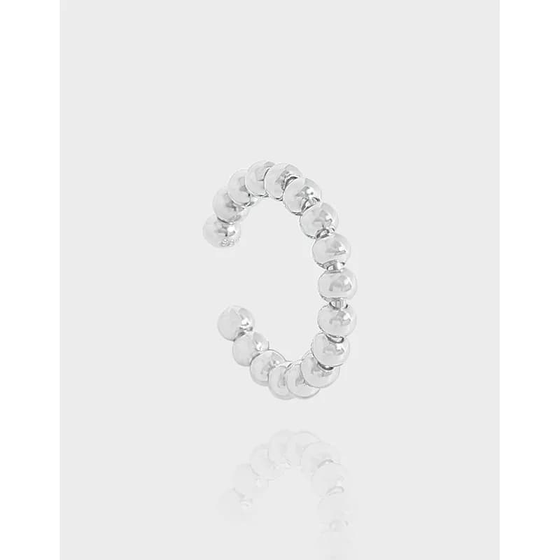 Polished sterling silver beaded-disc hoop earrings with an open end and reflective surface