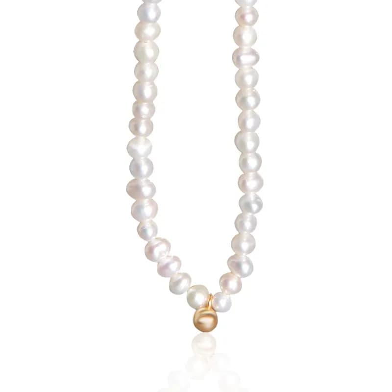 Pearl necklace with a single gold-tone bead pendant centered on a polished strand.