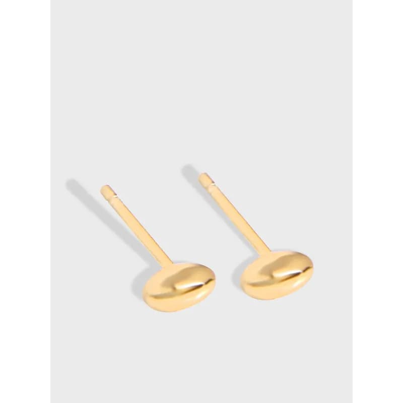 Polished sterling silver disc-bar stud earrings on a light background.