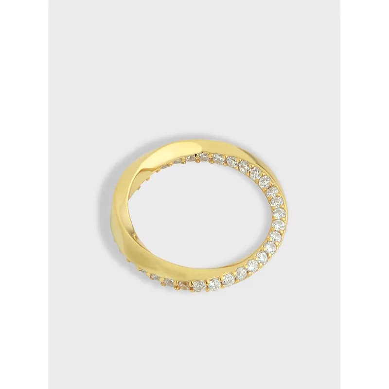 Polished sterling silver ring with a curved row of pavé stones along one side