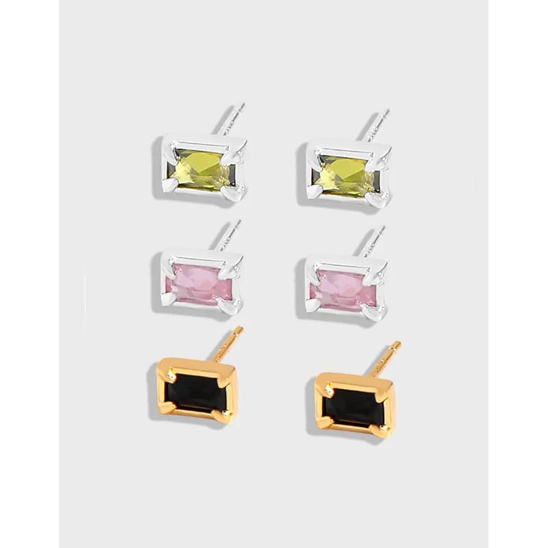 Six rectangular emerald-cut stud earrings in silver and gold tones with colored stones arranged in three color pairs.