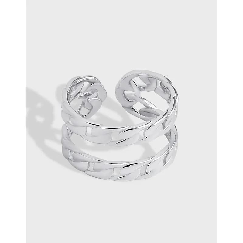Polished sterling silver triple-wrap ring with interlocking chain links on a light background.