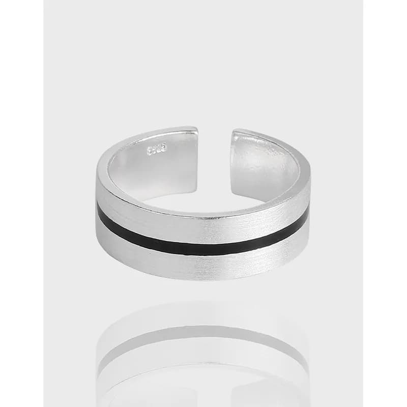Wide sterling silver ring with a black enamel stripe in an open cuff design.