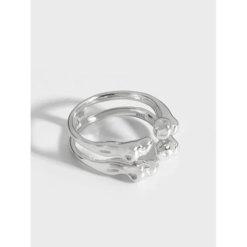 Polished sterling silver open-wrap ring with two wavy bands and a small bead at the end.