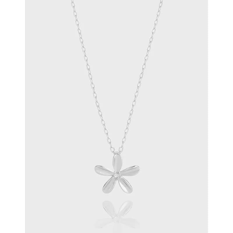 Polished sterling silver five-petal flower pendant on a delicate chain