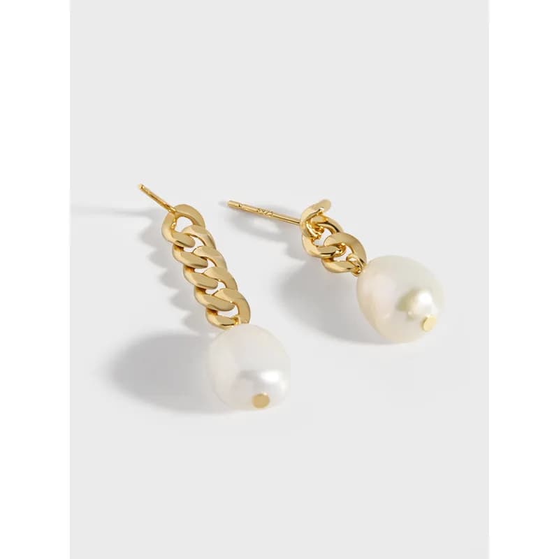 Polished earrings with a short chain and a single white pearl drop.