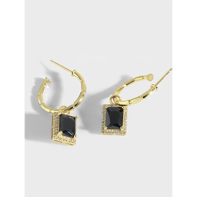 Polished sterling silver hoop earrings with square black gemstone pendant