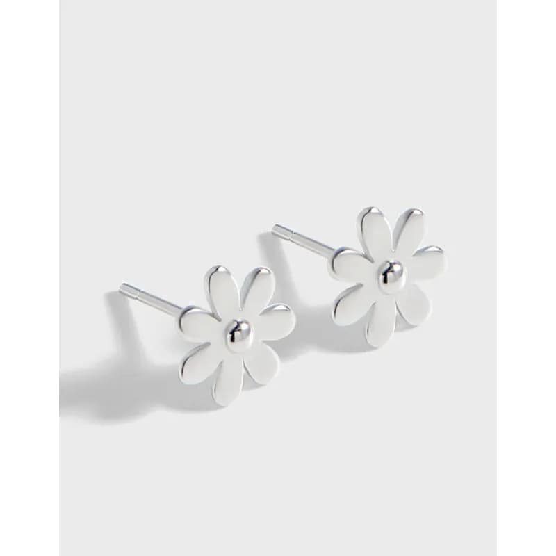 Polished sterling silver daisy flower stud earrings with six petals and a central bead.