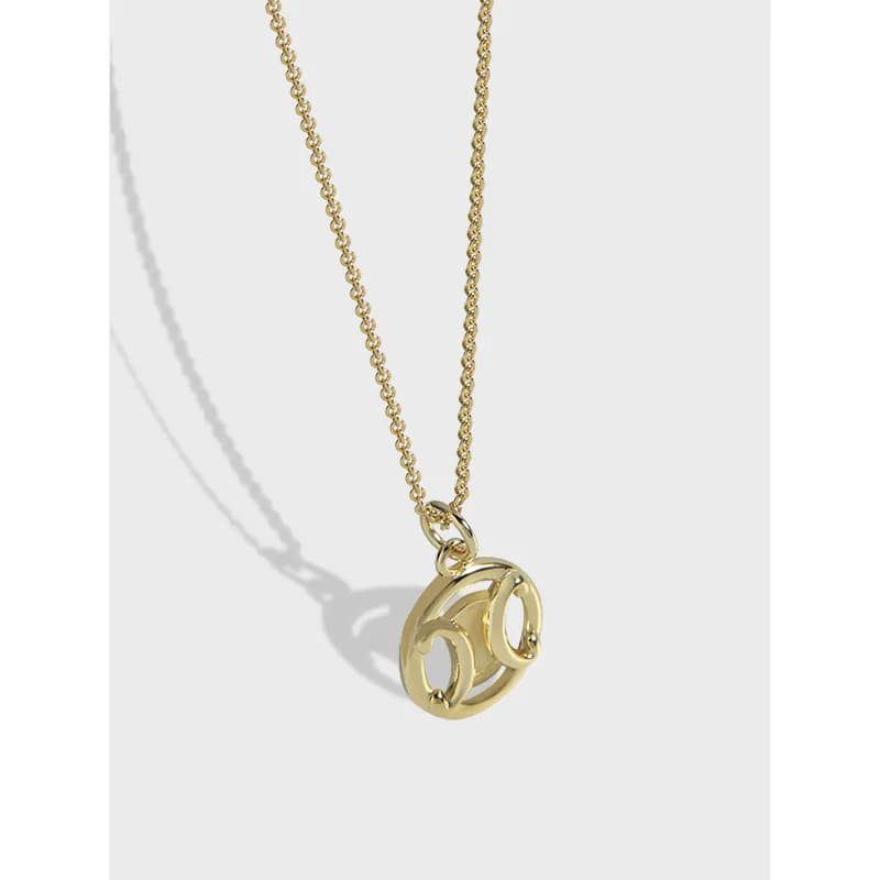 Polished sterling silver necklace with a round open interlocking C pendant on a delicate chain.