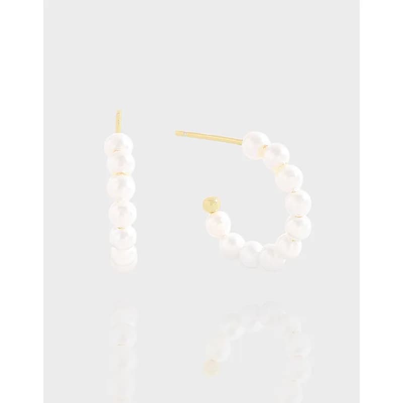 Pearl bead hoop earrings with a polished metal setting and a straight post, featuring a row of white pearls
