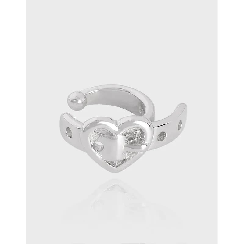 Polished sterling silver heart cuff earrings with an open curved band and heart centerpiece on the front.