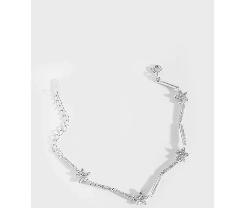 Delicate sterling silver bracelet with star pavé charms and an adjustable extension chain.