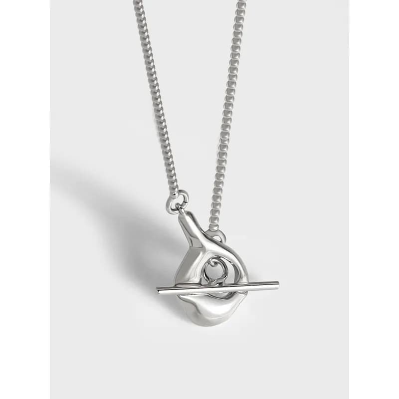 Polished sterling silver abstract pendant on a beaded chain necklace.