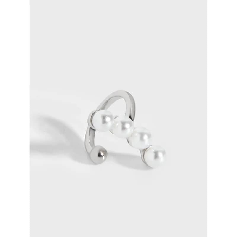 Polished sterling silver hoop earring with small white pearl beads arranged along the outer curve.