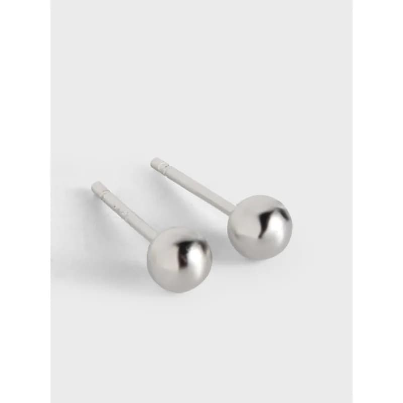 Polished sterling silver ball stud earrings on a white background.