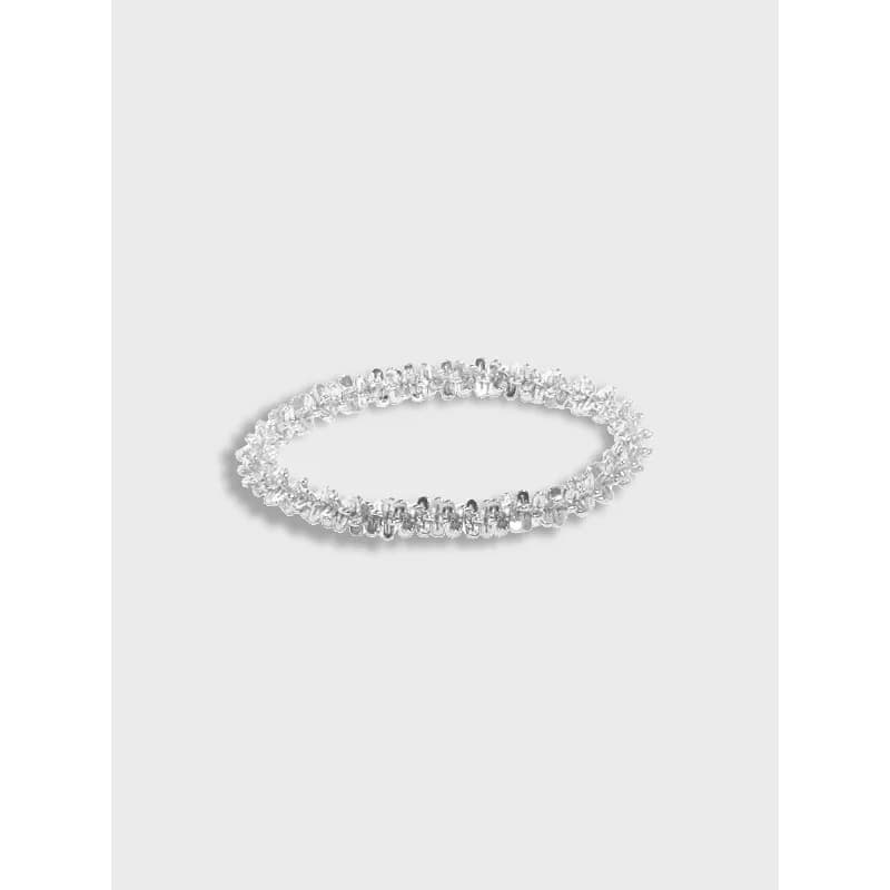 Polished sterling silver eternity ring with pavé-set stones around the band.