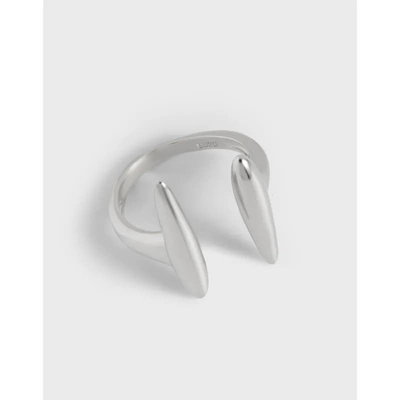 Polished sterling silver open ring with two elongated teardrop ends facing each other.