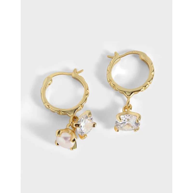 Polished sterling silver hoop earrings with crystal and pink pearl drop charms.
