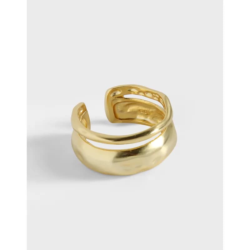 Polished curved open ring with a sculptural, fluid silhouette in sterling silver