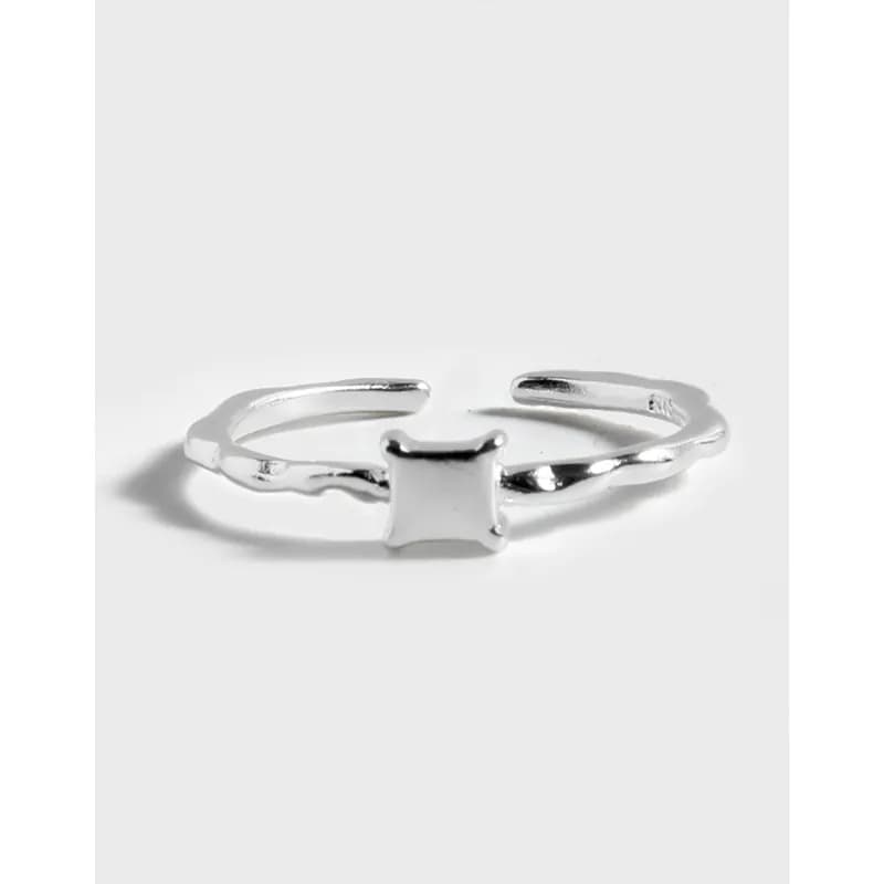Polished sterling silver open-band ring with a small squared central bar