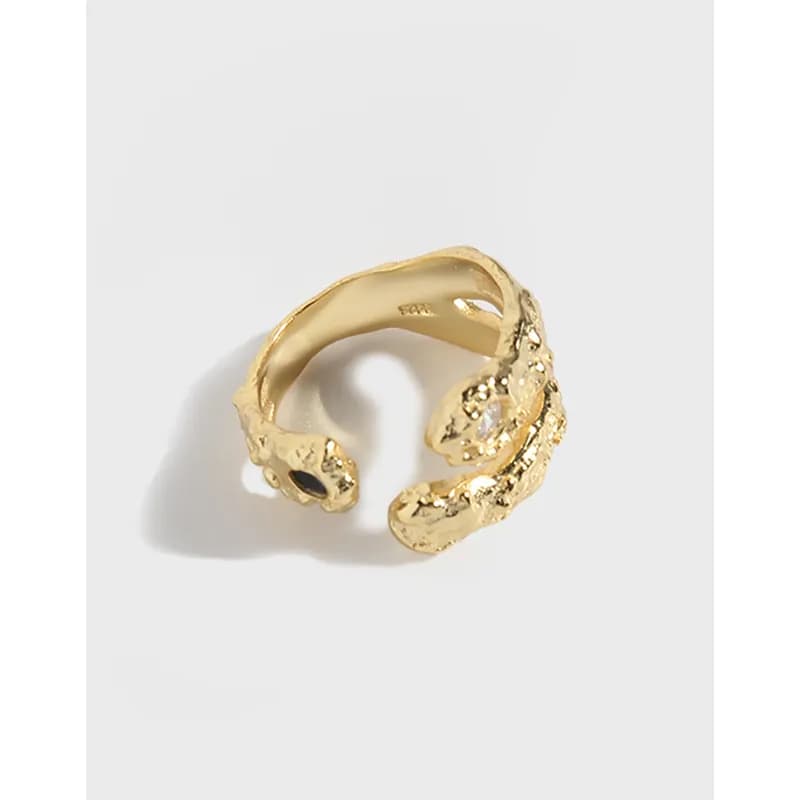Polished sterling silver open ring with textured coil design and sculptural ends.